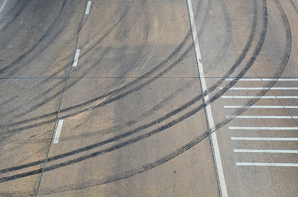 istock wheel tracks on the road 505115335