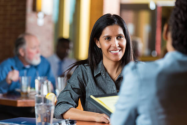 istock Woman being interviewed during meeting in restaurant 505115543