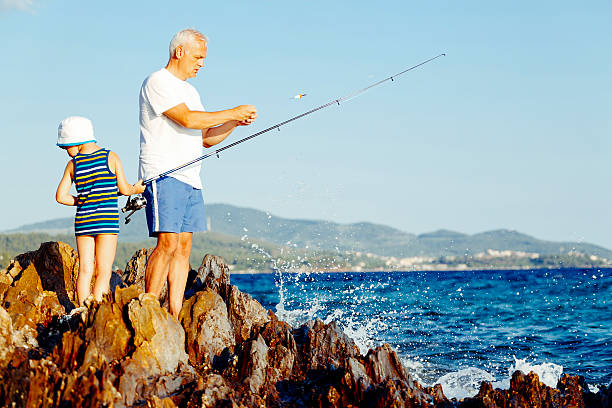 istock Father and Son Fishing Together. 505115927