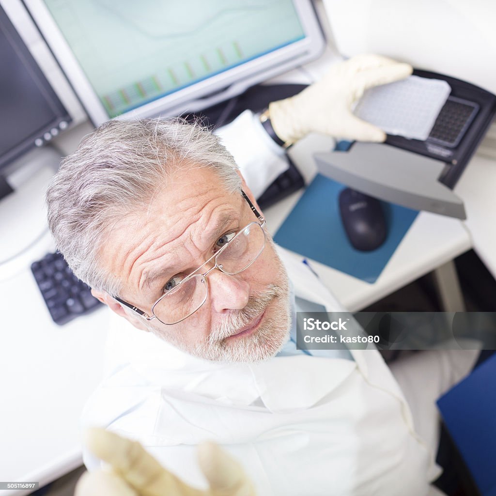 Life scientist researching in the laboratory. Life science researcher  performing a genotyping testing which enables personalized medicine. PM is a medical model that proposes the customization of healthcare. Adult Stock Photo