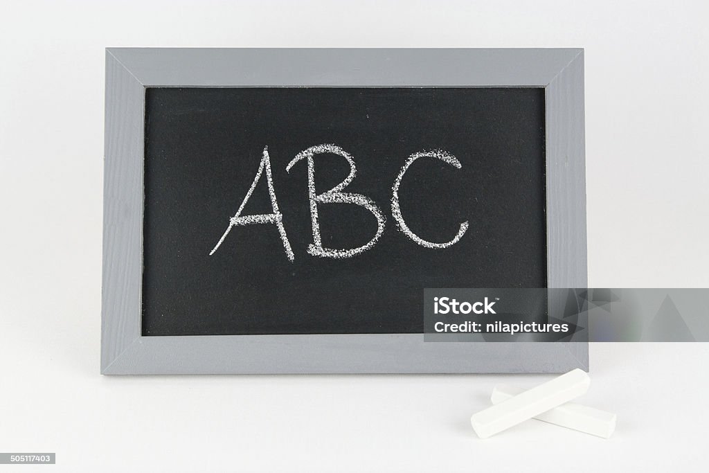 Table abc and chalk Tabel abc and chalk Alphabet Stock Photo