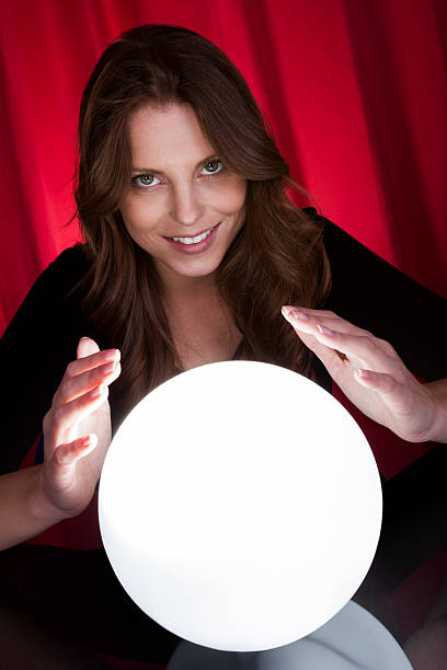 istock Fortuneteller with glowing ball 505117549