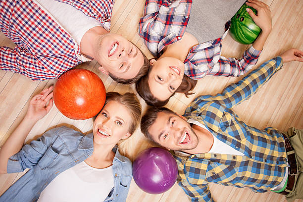 istock Attractive men and women are playing kegling 505124700