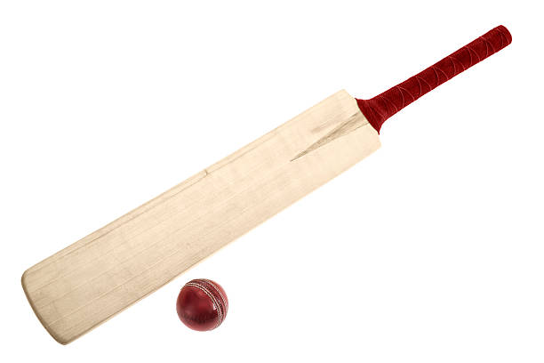 Wooden Cricket bat and ball on a white background stock photo