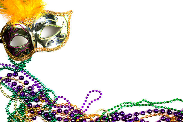 istock Mardi Gras background.  Purple, gold, green, mask, beads. 505125900