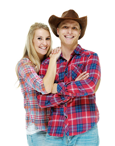 istock Happy cowboy couple standing together 505127140