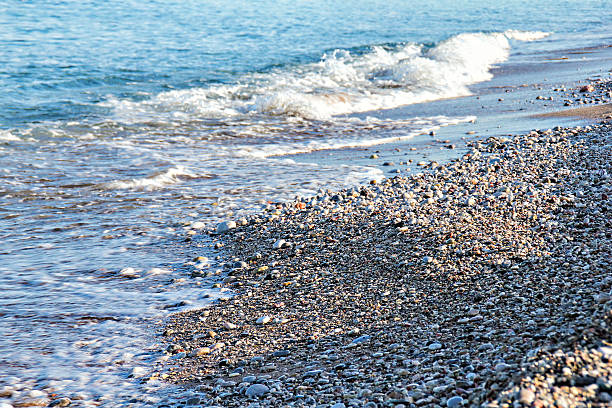 istock Incoming waves on the stone beach 505128302