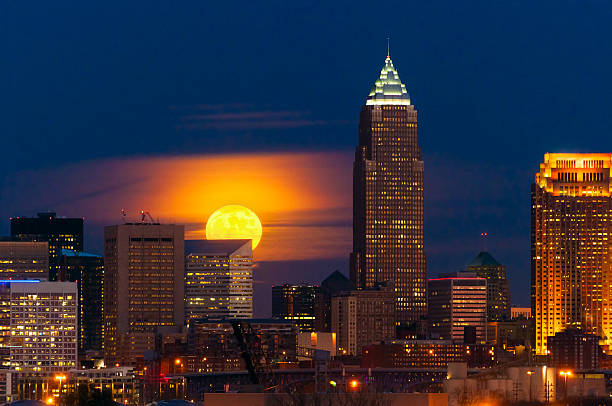 Moon rising over Cleveland stock photo