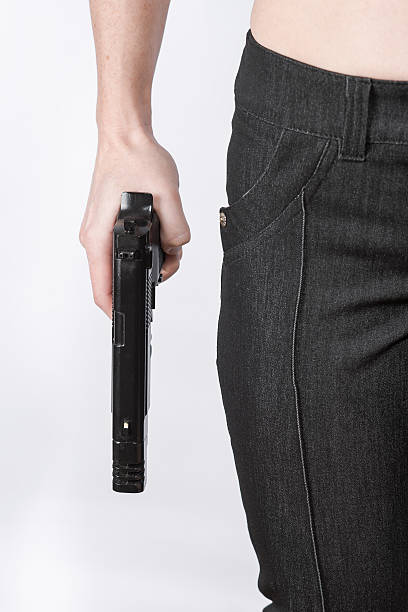 istock Woman holding a gun 505131430
