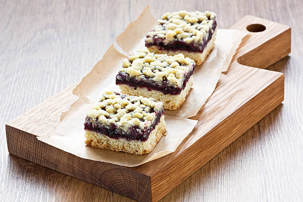 Black currant crumble pie bars stock photo