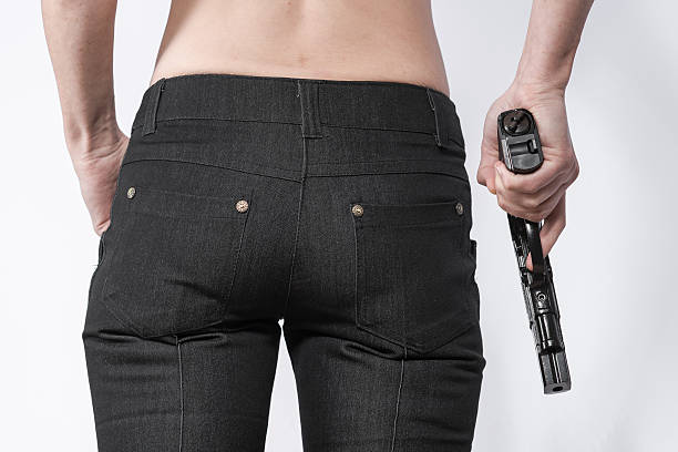 istock Woman holding a gun 505132140