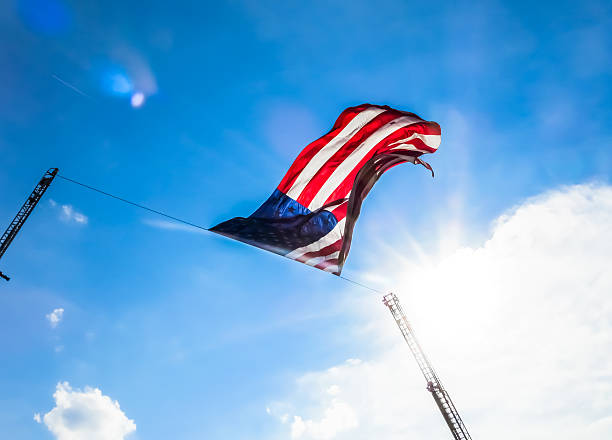 istock American Flag Flying From Extended Firetruck Ladders 505132240