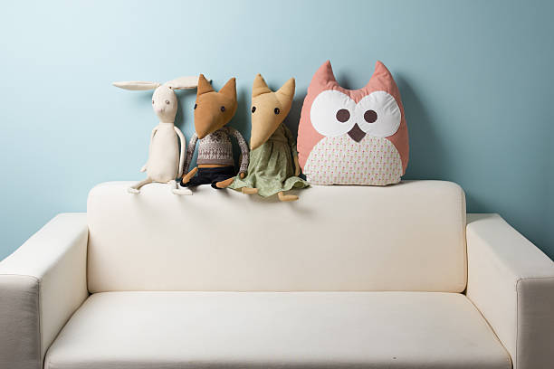 istock Home interior. Childhood. Blue background. Toy sitting on a couch. 505134440