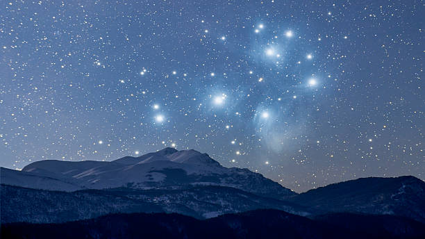 Starry winter night This is a combination of two photos taken separately, one of a mountain range, the other of Pleiades. Pleiades are out of proportion and the idea is to depict how it would look if the Deep Space Objects are closer to us, bigger and more visible. the pleiades stock pictures, royalty-free photos & images