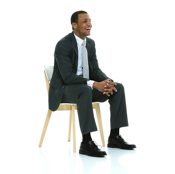 istock Cheerful businessman sitting on chair 505134812