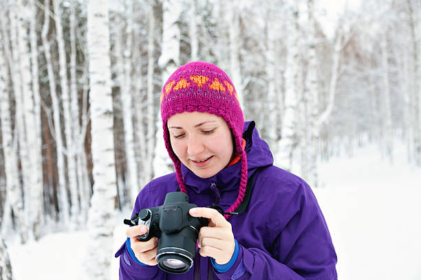 istock young girl with camera outdoors 505137486
