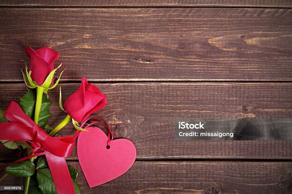 Valentine roses with gift tag Arrangement Stock Photo