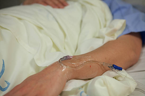 istock Saline drip in a mothers arm before a Caesarian operation 505143023