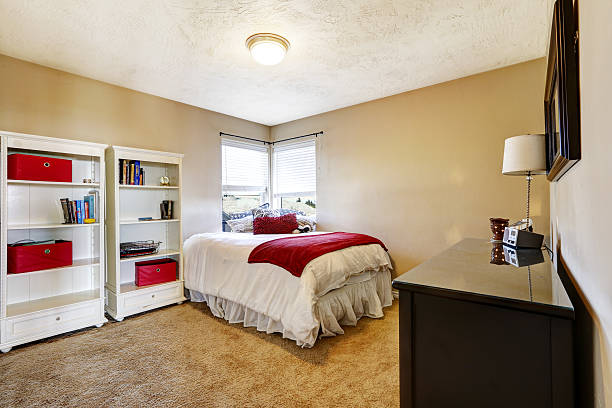 istock Bright bedroom with white bed and cabinets 505143213