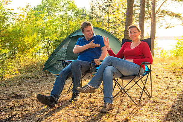 istock couple talking on a camping holiday 505148665