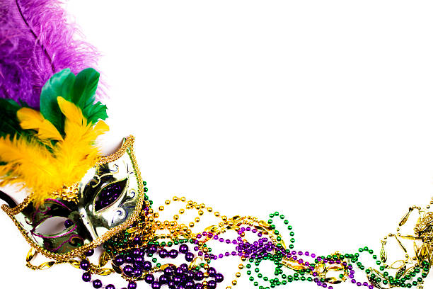 istock Mardi Gras background.  Purple, gold, green, mask, beads. 505159680