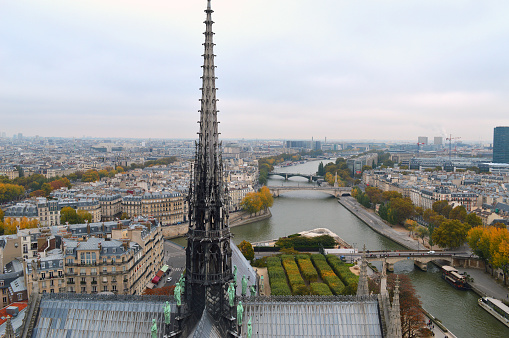 Paris, France - October 27, 2014: Looking east down the Seine River from above the Spire of Notre Dame de Paris.
