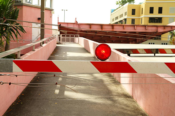 istock Red flashing light and barricade on top of a drawbridge 505160280