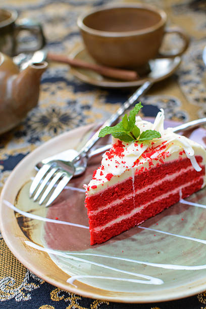 istock Red velvet cake with cup of tea and kettle 505160720