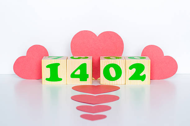 istock Wood cube with inscription 14 february and red hearts shape 505161480