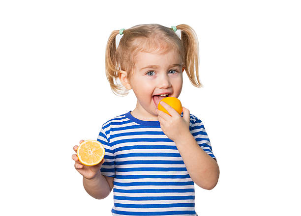 istock Little Funny girl keeps lemons 505161882