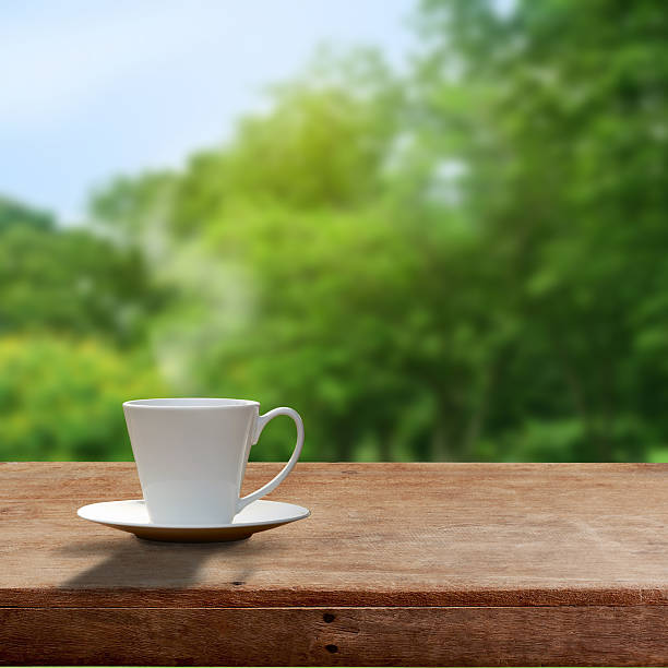 istock Cup of coffee on wooden table 505164328
