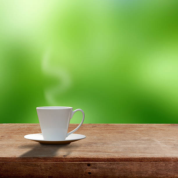 istock Cup of coffee on wooden table 505164406