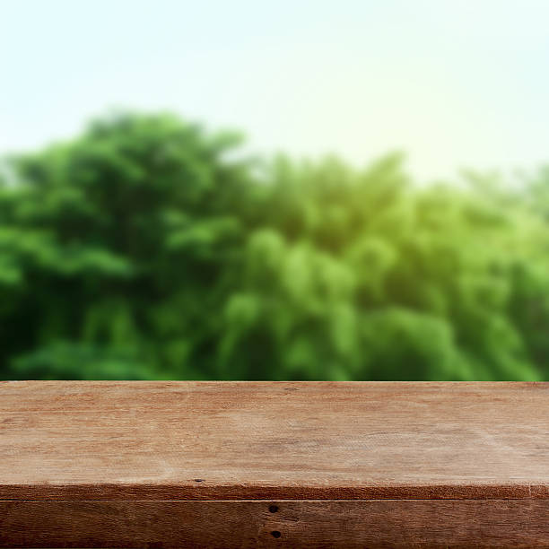 istock Abstract green background and wooden table 505164618