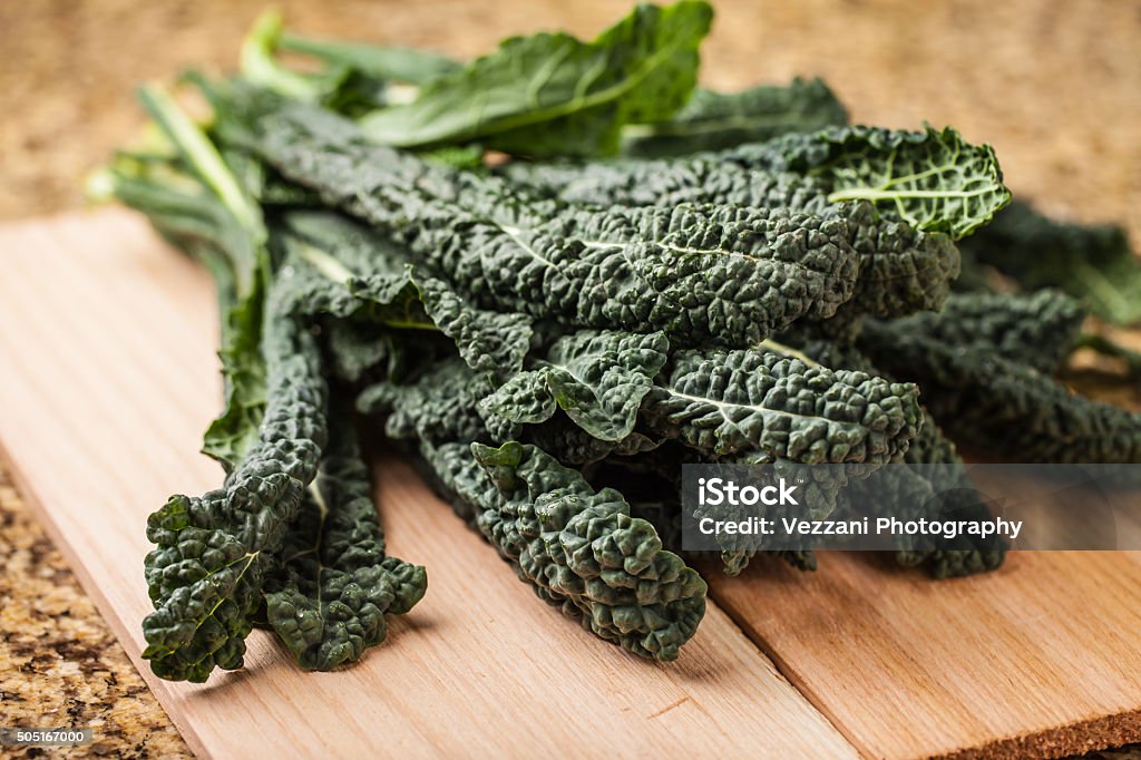 Vibrant bunch of freshly harvested lacinato kale Bunch of freshly harvested lacinato kale top view Kale Stock Photo