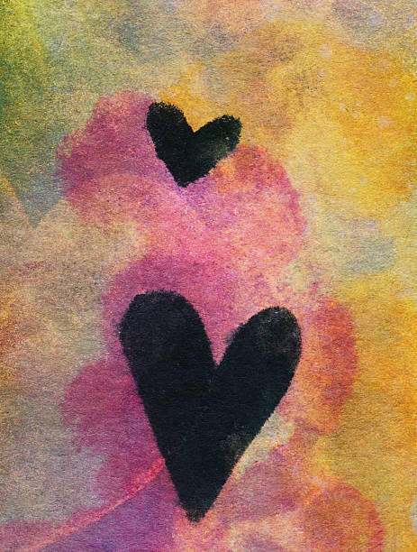 istock Two black hearts hand painted on a bright colorful background 505167504