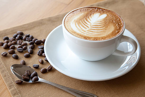 istock Cup of cafe' latte with coffee beans 505169040