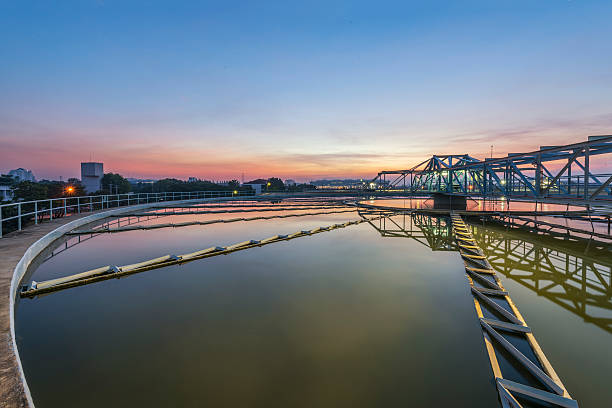 istock sedimentation basin, sewage flowing through large tanks 505169456