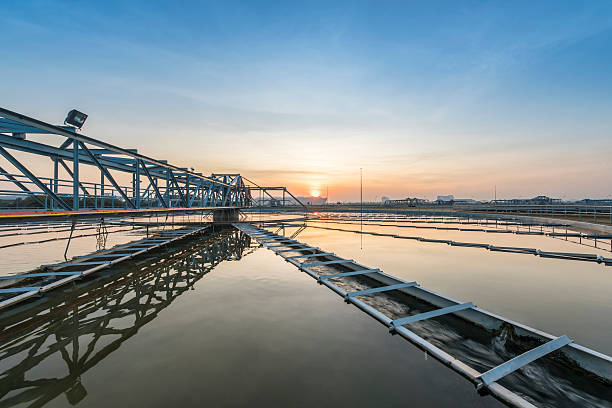 istock sedimentation basin, sewage flowing through large tanks 505169576
