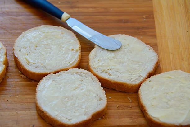 istock slices of white bread with butter and a knife 505170018