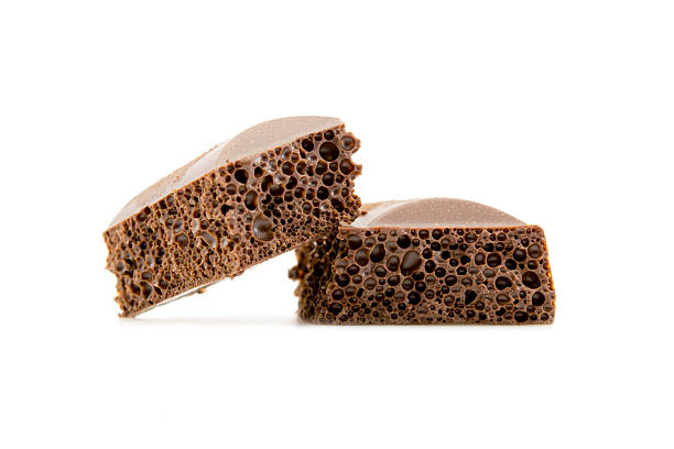 istock porous chocolate close-up isolated on white 505170054