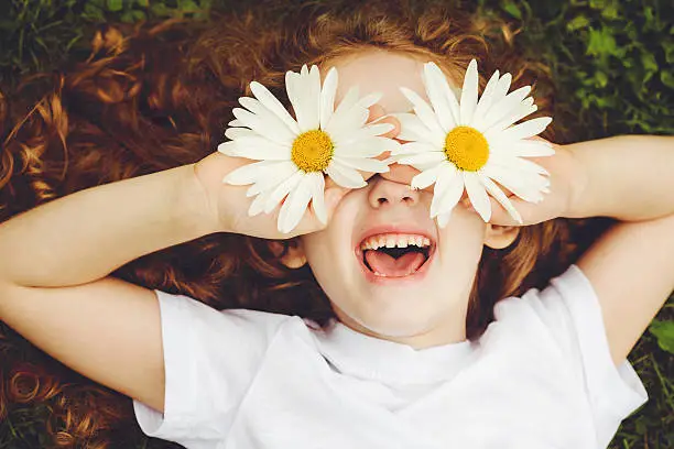 Photo of Child with daisy eyes.