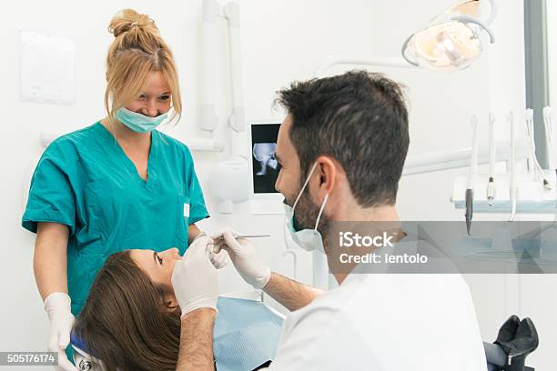 Doctor And The Assistant During A Surgery Stock Image Stock Photo - Download Image Now