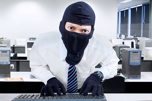 istock Businessman wearing mask stealing information 505198617