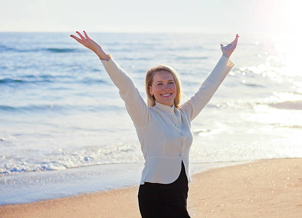 istock Woman with her arms raised 505200629