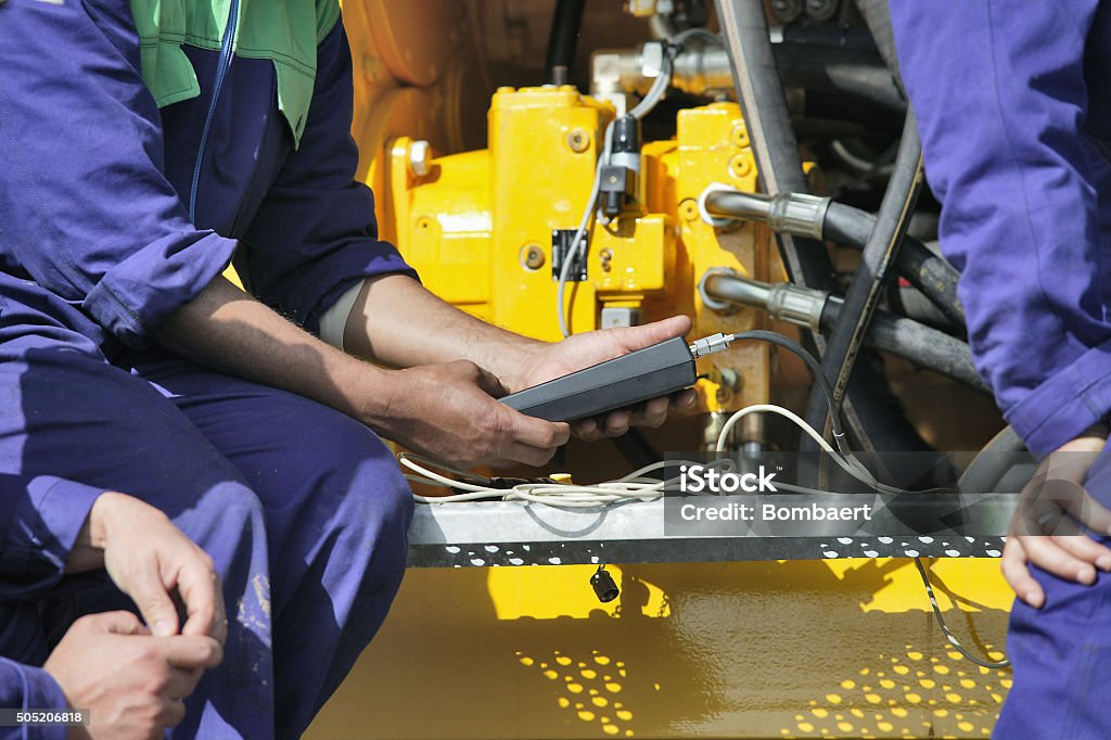 Engine maintenance Technician performing periodic engine maintenance Generator Stock Photo