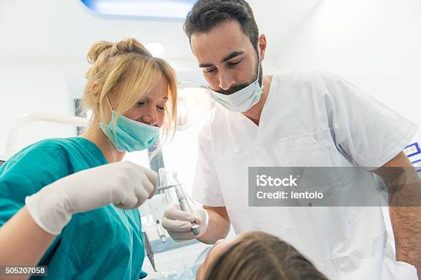 Doctor And The Assistant During A Surgery Stock Image Stock Photo - Download Image Now