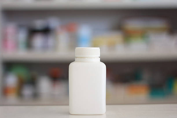 istock Blank white medicine bottle with drugstore background 505207528