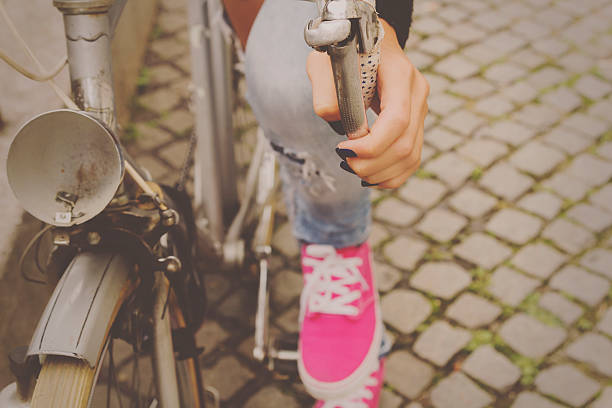 istock Hipster girl with old bicycle. 505208384