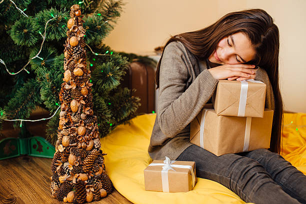 istock Little child sleeping with her presents 505209240