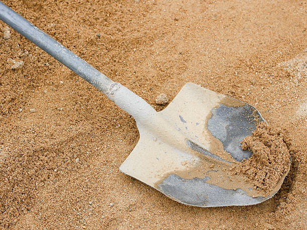 istock dirty shovel on sand 505209642